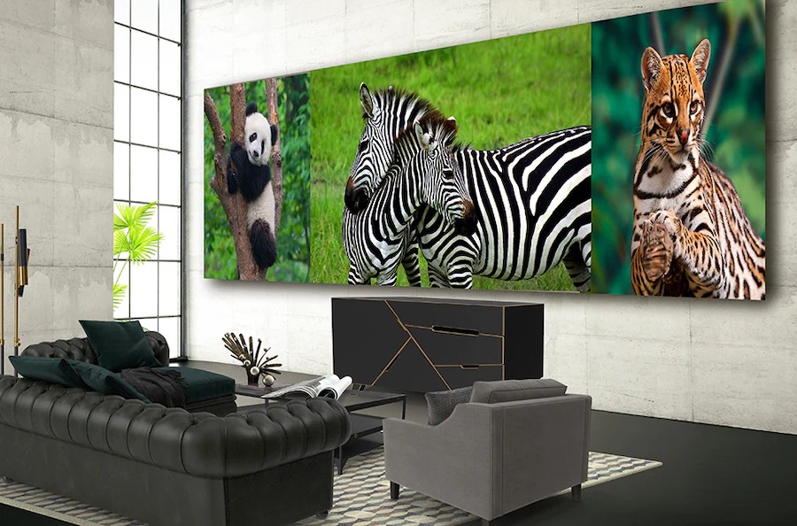 Extra-large video wall display in modern residence showing photographic artwork.