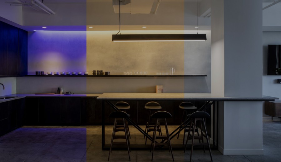 Modern kitchen with Ketra lighting system showing color capabilities.